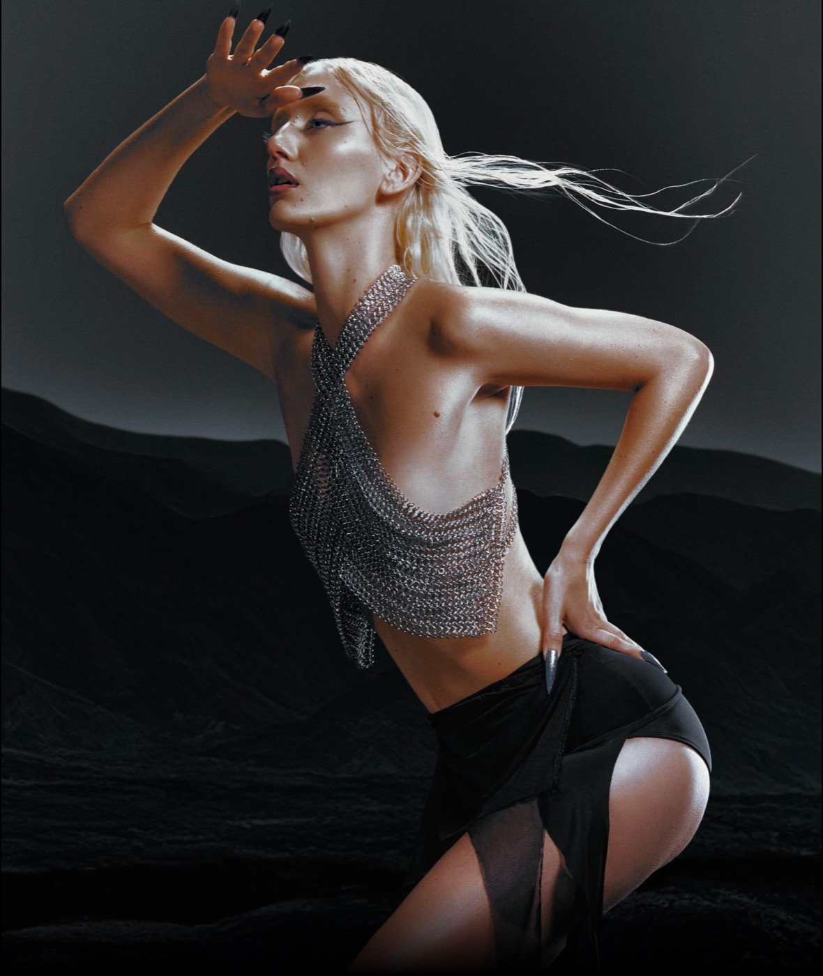 Irina in chainmail against dark dunes, personal editorial work.