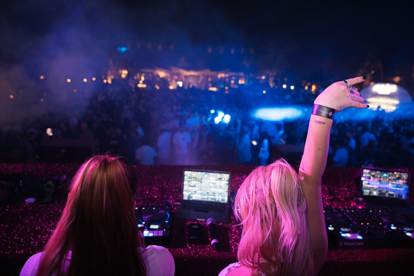 DJs above a crowd in blue and pink light at Bresh, Terra Solis.